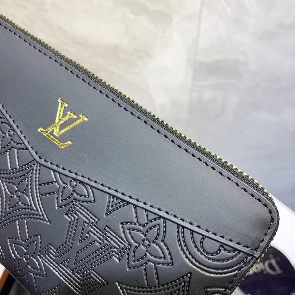 Louis Vuitton Wallet Made of Leather Embossed with the Brand's Logo