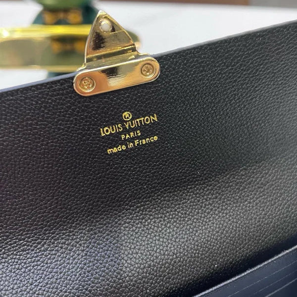 Louis Vuitton Slender Wallet – Monogram Seal Embossed Cowhide
